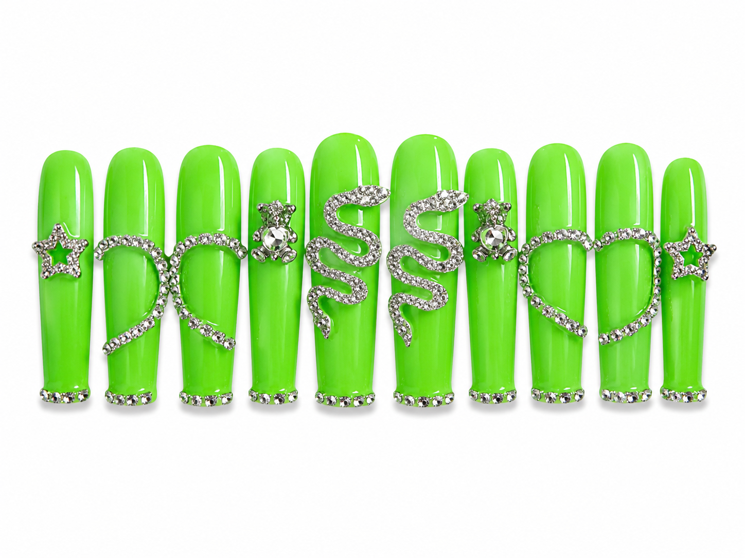 Handmade long coffin press-on nails in glossy neon green featuring silver rhinestone snake charms, heart outlines, teddy bear accents, and star details for a bold luxury statement nail design on a white background.
