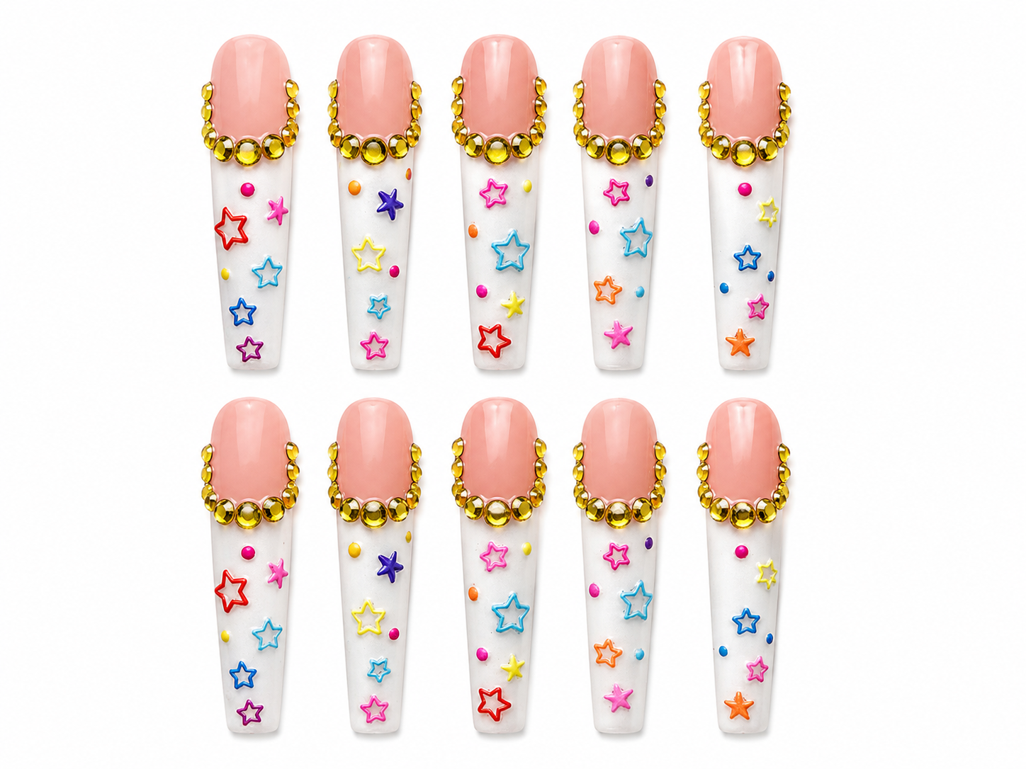 Handmade long coffin press-on nails featuring nude pink and white designs with gold rhinestone cuticle accents, colorful star art, and playful multicolor dot details on a clean white background.