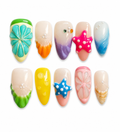Tropical almond press-on nails with 3D starfish accents, colorful flower designs, seashell-inspired nail art, glossy finish, and vibrant beach-themed details displayed on a white background.